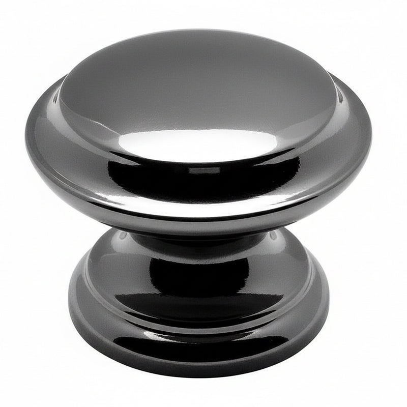 Subtle raised centre drawer knob in black nickel finish with one and three eighths inch diameter