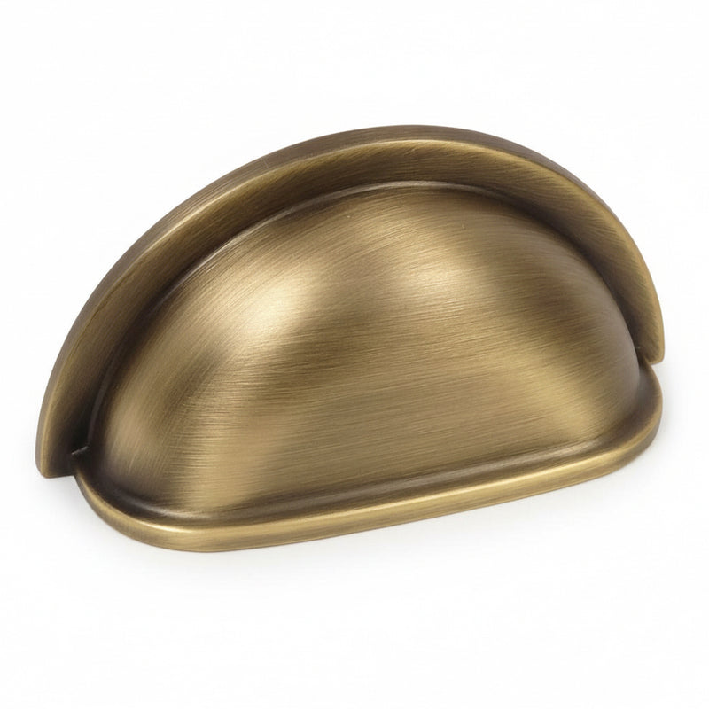Three inch hole spacing cabinet cup pull in brushed antique brass finish