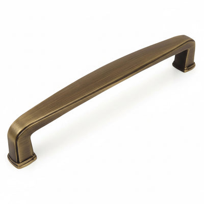 Subtle wide cabinet drawer pull in brushed antique brass finish with six and five sixteenths inch hole spacing