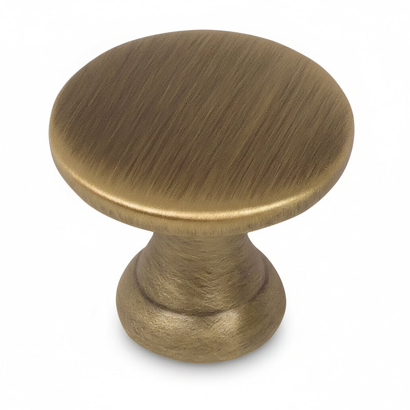 Round brushed antique brass drawer knob with flat top and seven and eights inch diameter