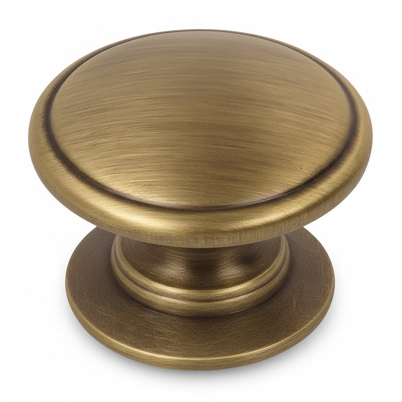 Brushed antique brass drawer knob with slightly raised centre