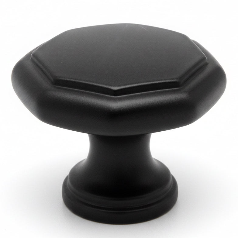 Flat black cabinet drawer knob with octagonal shape and one and a quarter inch diameter