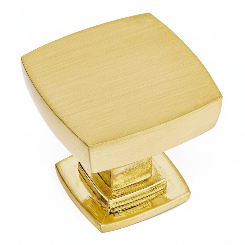 Cabinet drawer knob in brushed brass finish with convex square design