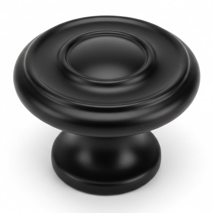 Round diameter knob in flat black finish with two raised rings and one and three sixteenths inch diameter