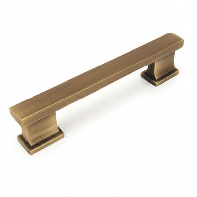 Sturdy cabinet pull in brushed antique brass finish with square edge design and three and a half inch hole spacing