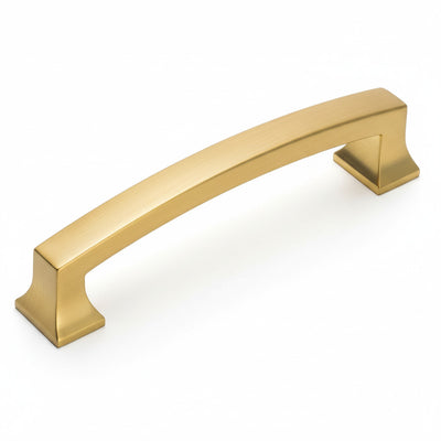 A brushed brass cabinet pull by Cosmas with an arched shape and a brushed brass finish.