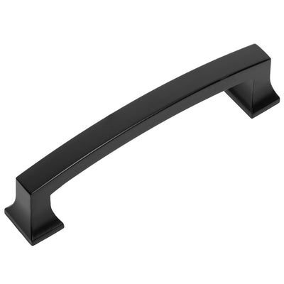 A flat black cabinet pull with a sleek, curved design.