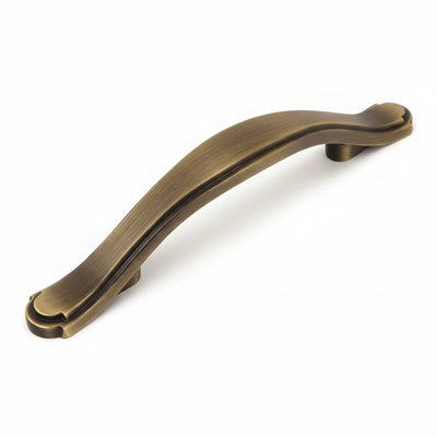Cabinet pull in brushed antique brass finish with engraving on edge and three inch hole spacing