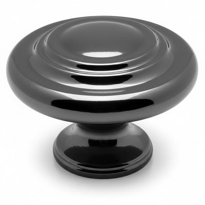Round cabinet knob in black nickel finish with two raised rings on the centre and thicker subtle edges