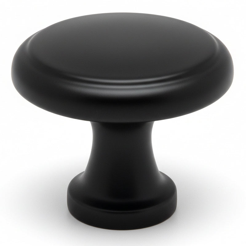 Round cabinet knob in flat black finish with slightly raised centre design