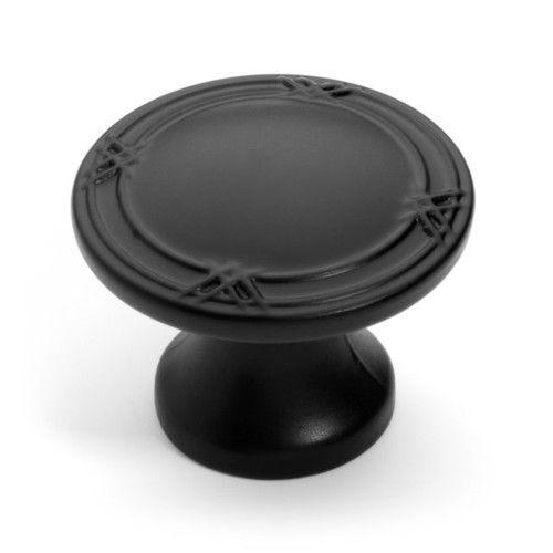 Round flat furniture knob with one and three eighths inch diameter in flat black finish