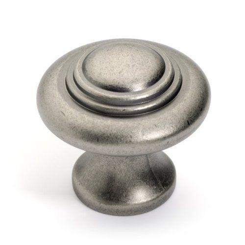 Concentric rings cabinet knob in antique nickel finish with one and three eighths inch diameter and a small raised head at the center 