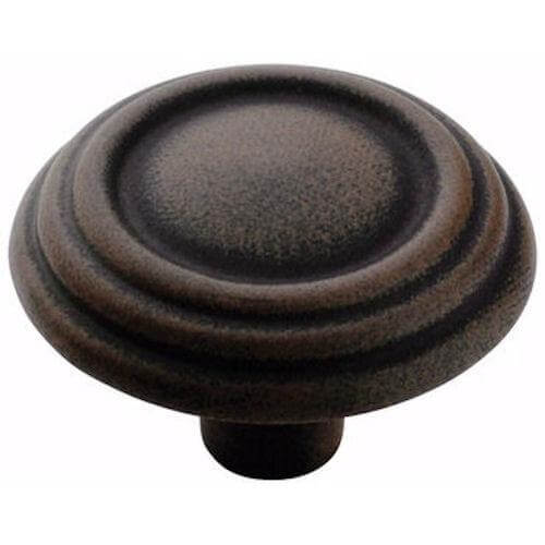 Round cabinet knob in antique rust finish with triple rings design