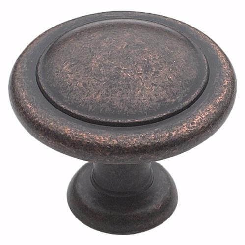 Rustic bronze round cabinet knob with one and a quarter inch of diameter and flat surface