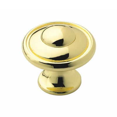 Drawer knob in polished brass finish with elegant slightly elevated center